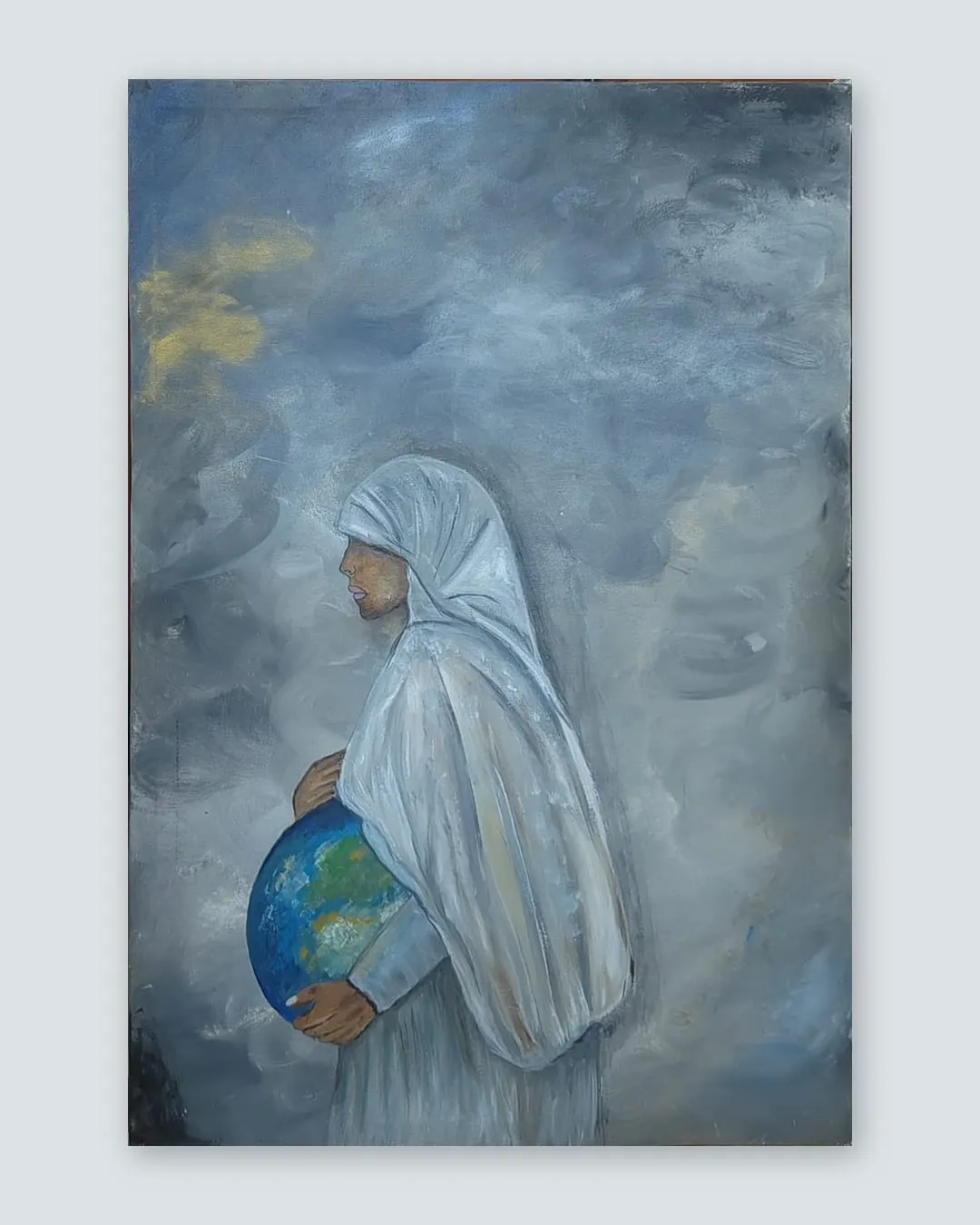 Mother Earth by Hafsa Imran shown as a stretched canvas against a plain grey wall