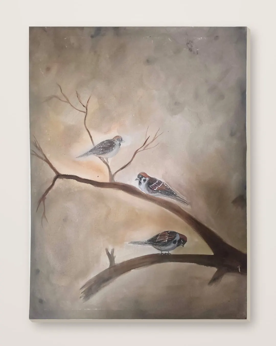 Tawakkul (Sparrows on a Branch) by Hafsa Imran shown as a stretched canvas against a plain cream wall