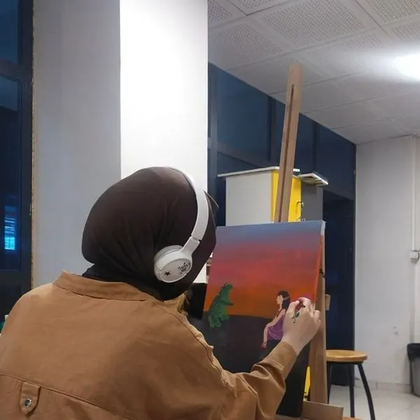 Hafsa Imran — founder of Bloom & Beyond, painting at her art studio in Lahore, Pakistan