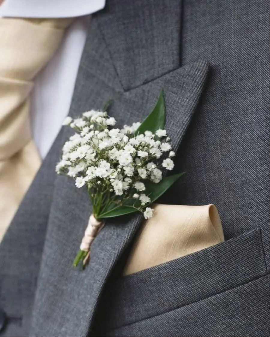A minimalist baby breath boutonniere for a clean, rustic look — handcrafted by Bloom & Beyond in Lahore