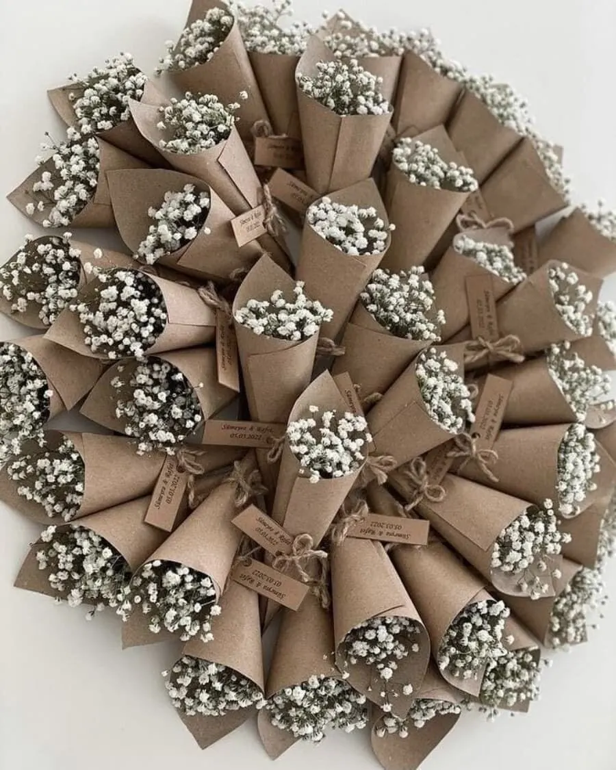 A set of 10 mini baby breath bouquet favours wrapped in kraft paper cones — handcrafted by Bloom & Beyond in Lahore