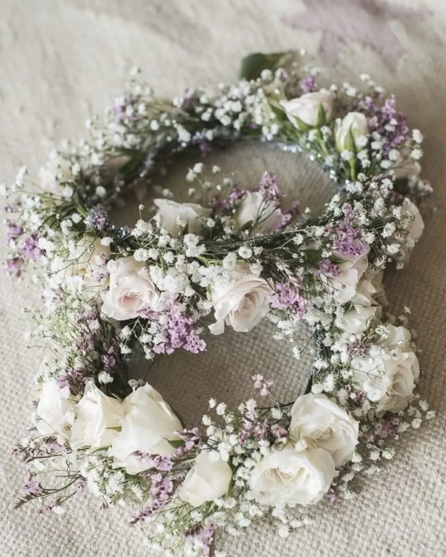 A delicate flower crown of white roses with lavender baby breath accents — handcrafted by Bloom & Beyond in Lahore