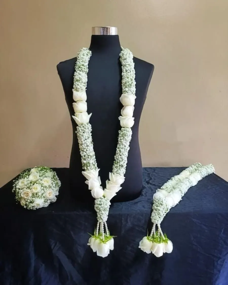 Everything the bride and groom need — bridal bouquet, groom's sehra, matching garlands, and coordinated bouquet for the ceremony — handcrafted by Bloom & Beyond in Lahore