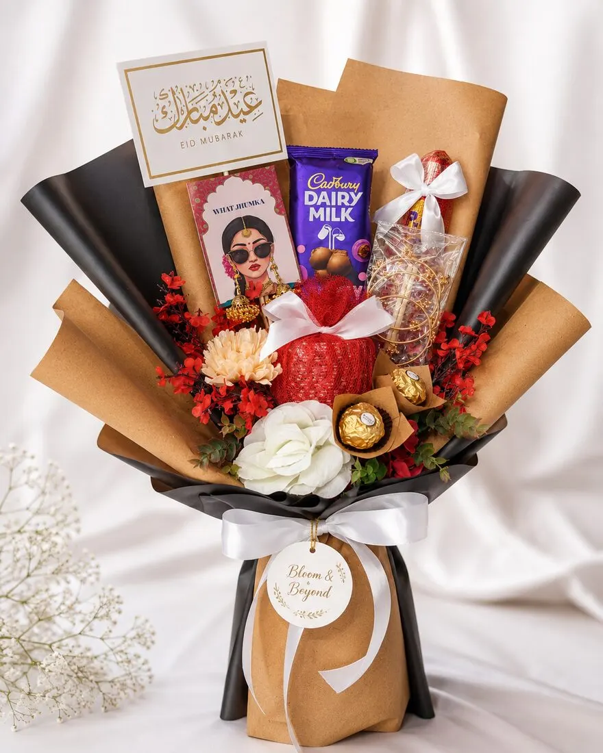 A standing Eid chocolate bouquet wrapped in black and kraft, with Cadbury Dairy Milk, Ferrero Rocher — handcrafted by Bloom & Beyond in Lahore