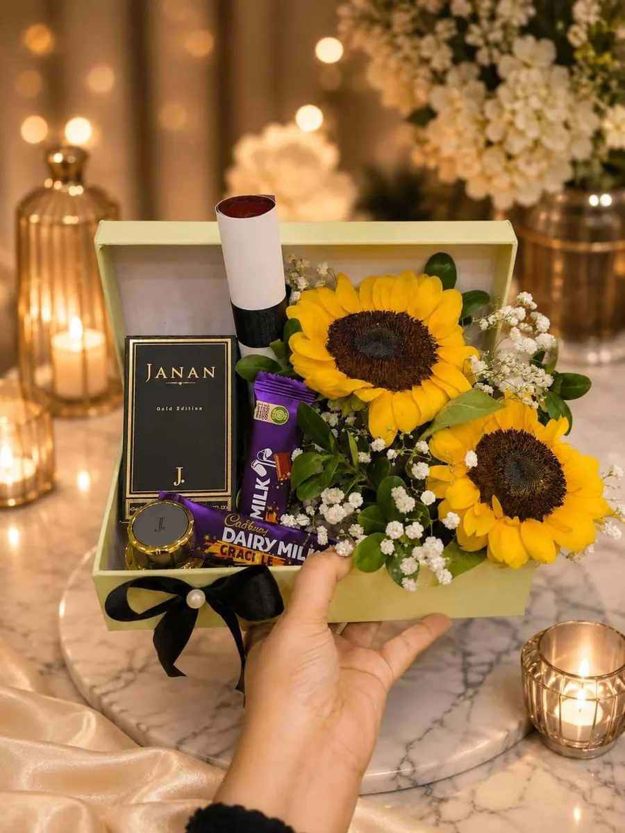 A pistachio-green keepsake box holding a Junaid Jamshed (J.) Janan Gold Edition fragrance, Cadbury Dairy Milk bars — handcrafted by Bloom & Beyond in Lahore