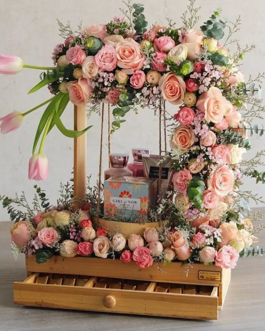 A luxurious hamper for the bride-to-be — includes roses, premium perfume, and decorative elements on a beautiful display swing — handcrafted by Bloom & Beyond in Lahore