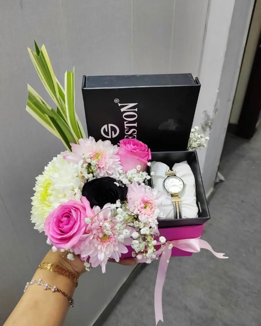 Watch and flower gift box — a wristwatch presented with pink flowers in a premium keepsake box — handcrafted by Bloom & Beyond in Lahore