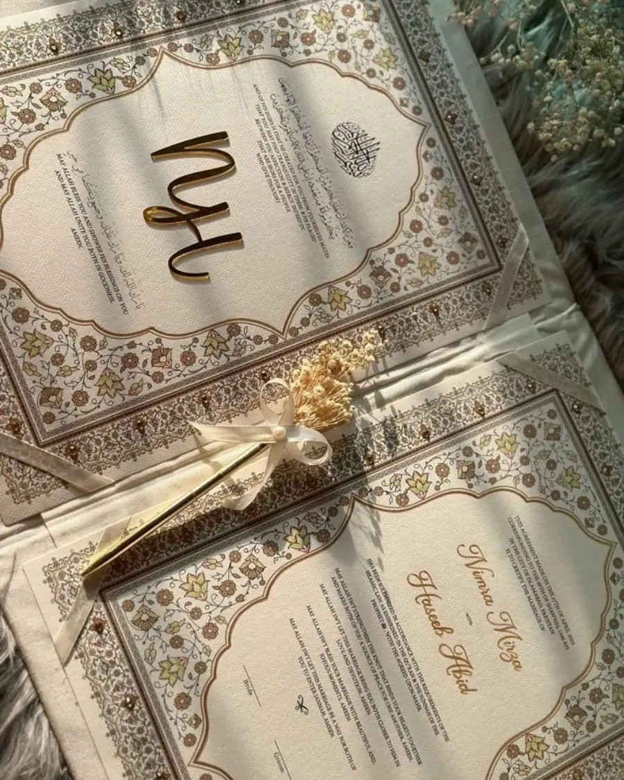 A beautifully designed Nikkah invitation with hand-painted floral patterns and gold accents — handcrafted by Bloom & Beyond in Lahore