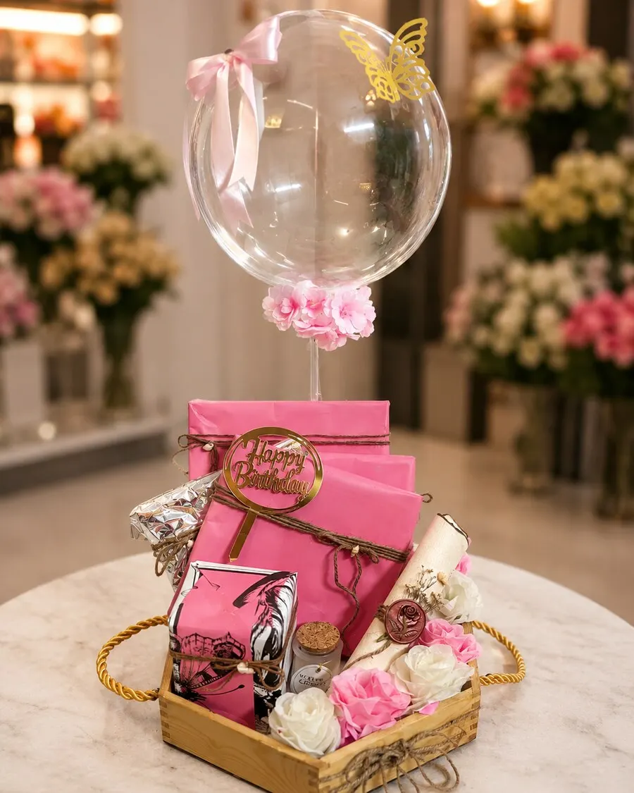 A premium signature hamper centred on four real hand-painted artworks by Hafsa — handcrafted by Bloom & Beyond in Lahore