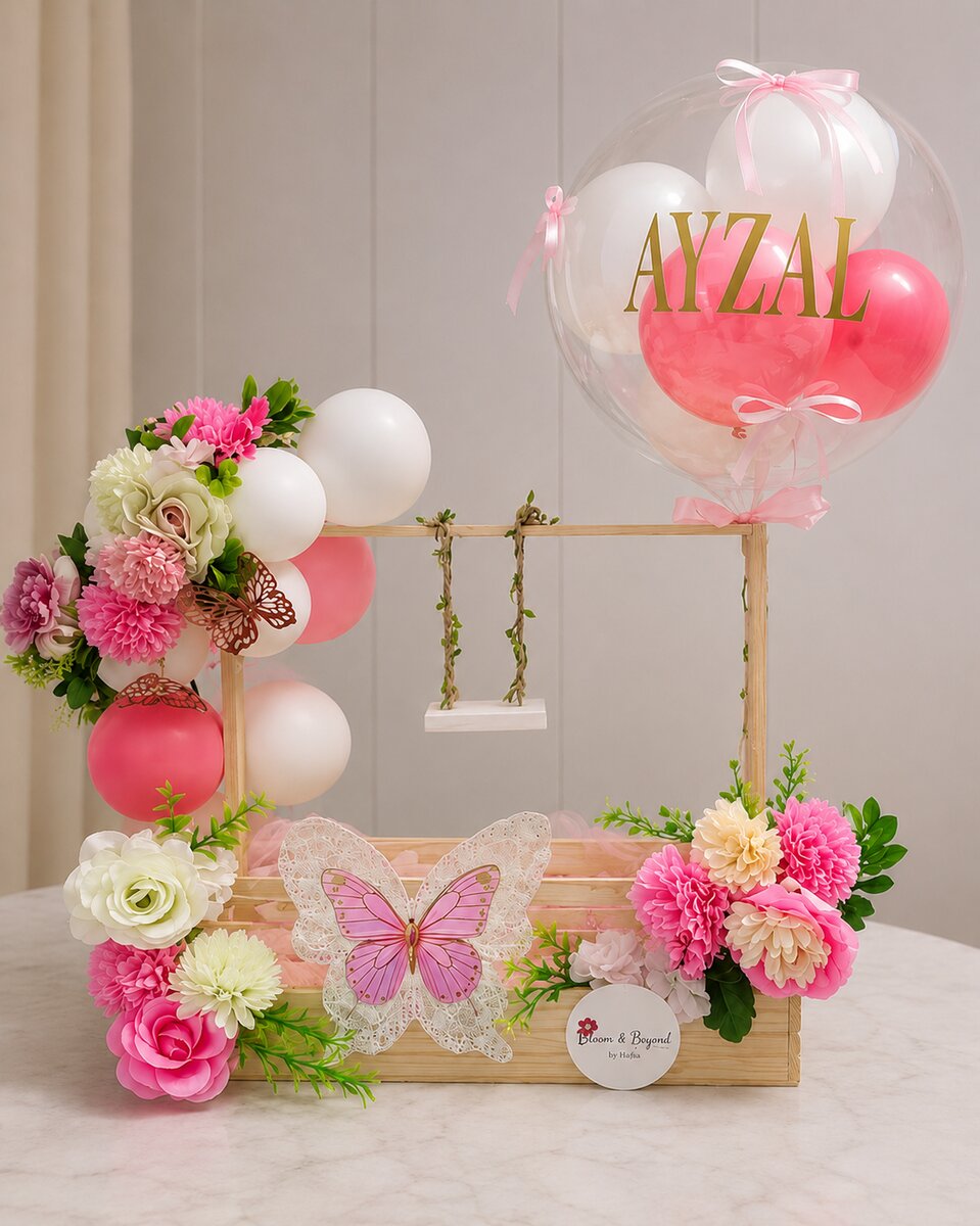 Welcome the newest family member with a pink-themed basket — includes personalised name balloon, flowers, butterfly decoration — handcrafted by Bloom & Beyond in Lahore