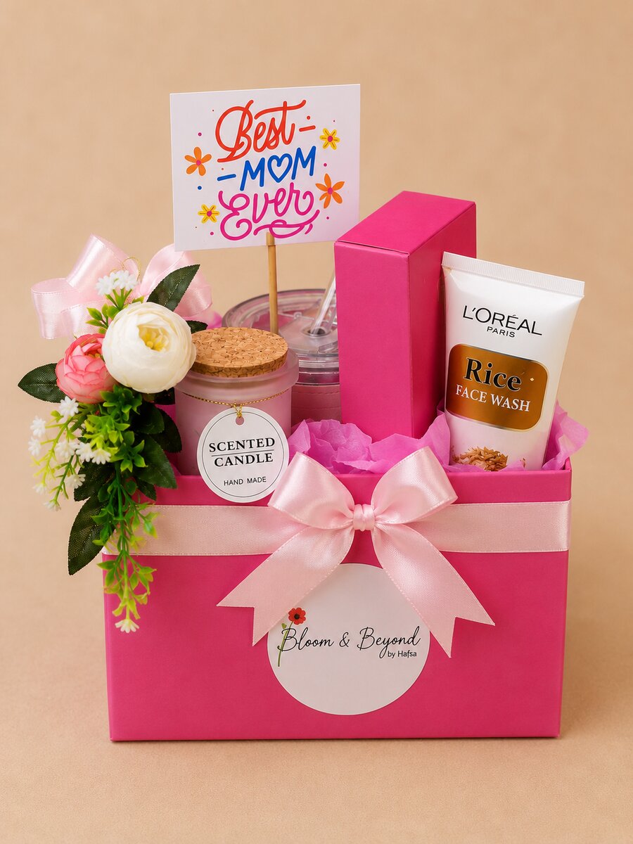 A premium Mother's Day gift hamper in pink — a hand-tied posy of pink and white roses with greenery — handcrafted by Bloom & Beyond in Lahore