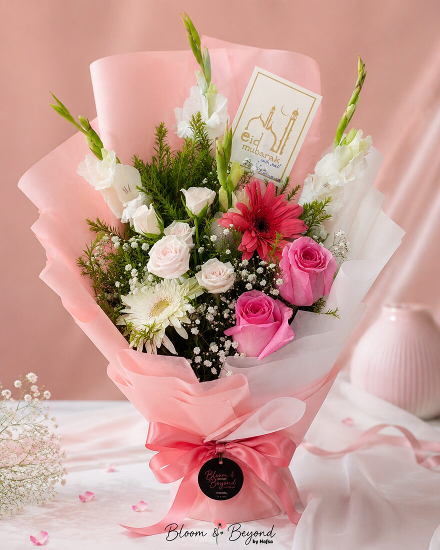 Eid flower bouquet of white gladiolus, pink roses and red and white gerberas with a gold Eid Mubarak card — handcrafted by Bloom & Beyond in Lahore