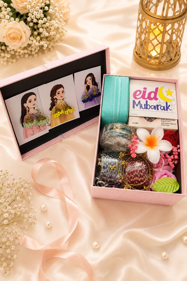 A glam Eid gift box for her — a teal zardozi clutch, glittering bangles, a frangipani bloom, comb and preserved flowers — handcrafted by Bloom & Beyond in Lahore