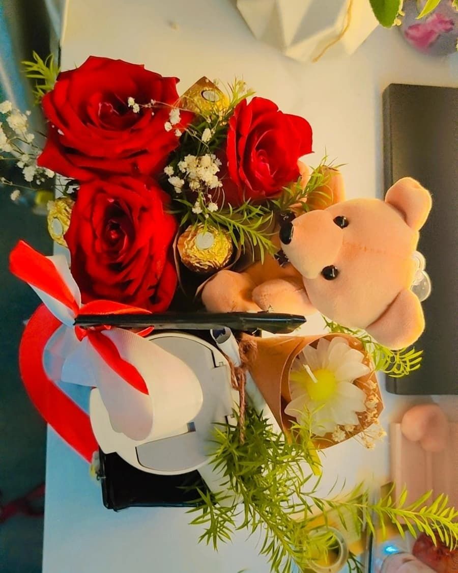A luxurious love box with red roses, teddy bear, Ferrero Rocher, and an elegant pen — handcrafted by Bloom & Beyond in Lahore