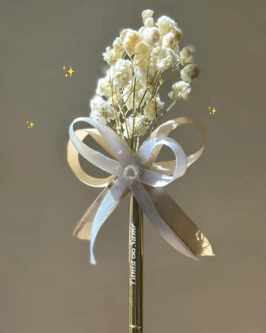 An elegantly decorated gold pen for the Nikkah signing ceremony — handcrafted by Bloom & Beyond in Lahore