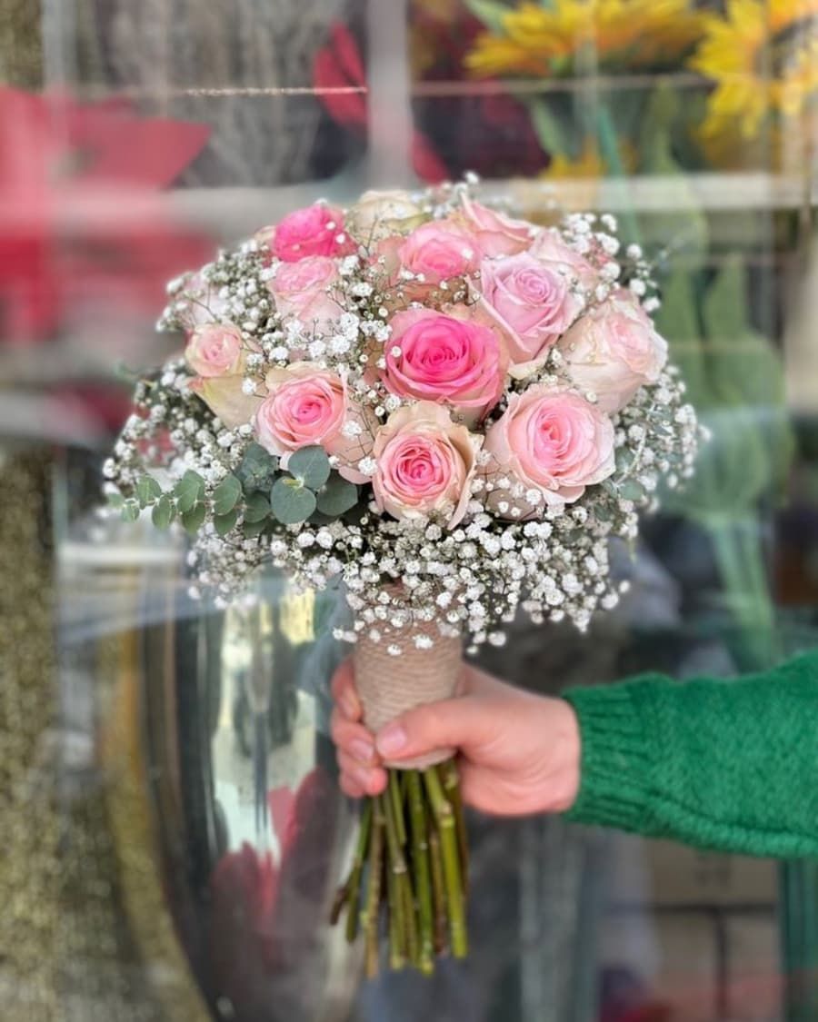 Pink roses nestled in a cloud of baby breath — our most popular combination — handcrafted by Bloom & Beyond in Lahore